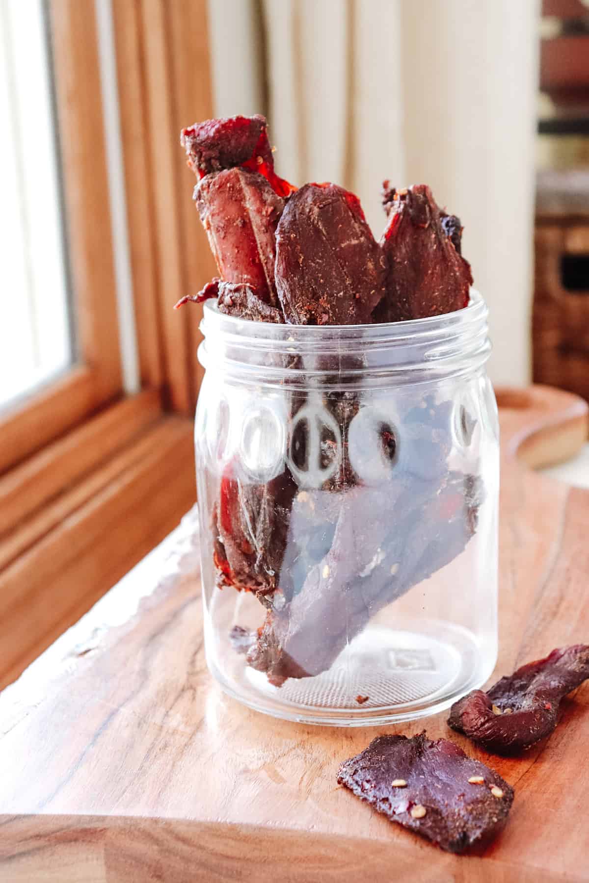 Final shot venison jerky in glass jar.