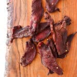 Featured photo of cooked venison jerky.