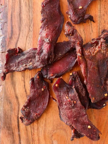 Featured photo of cooked venison jerky.