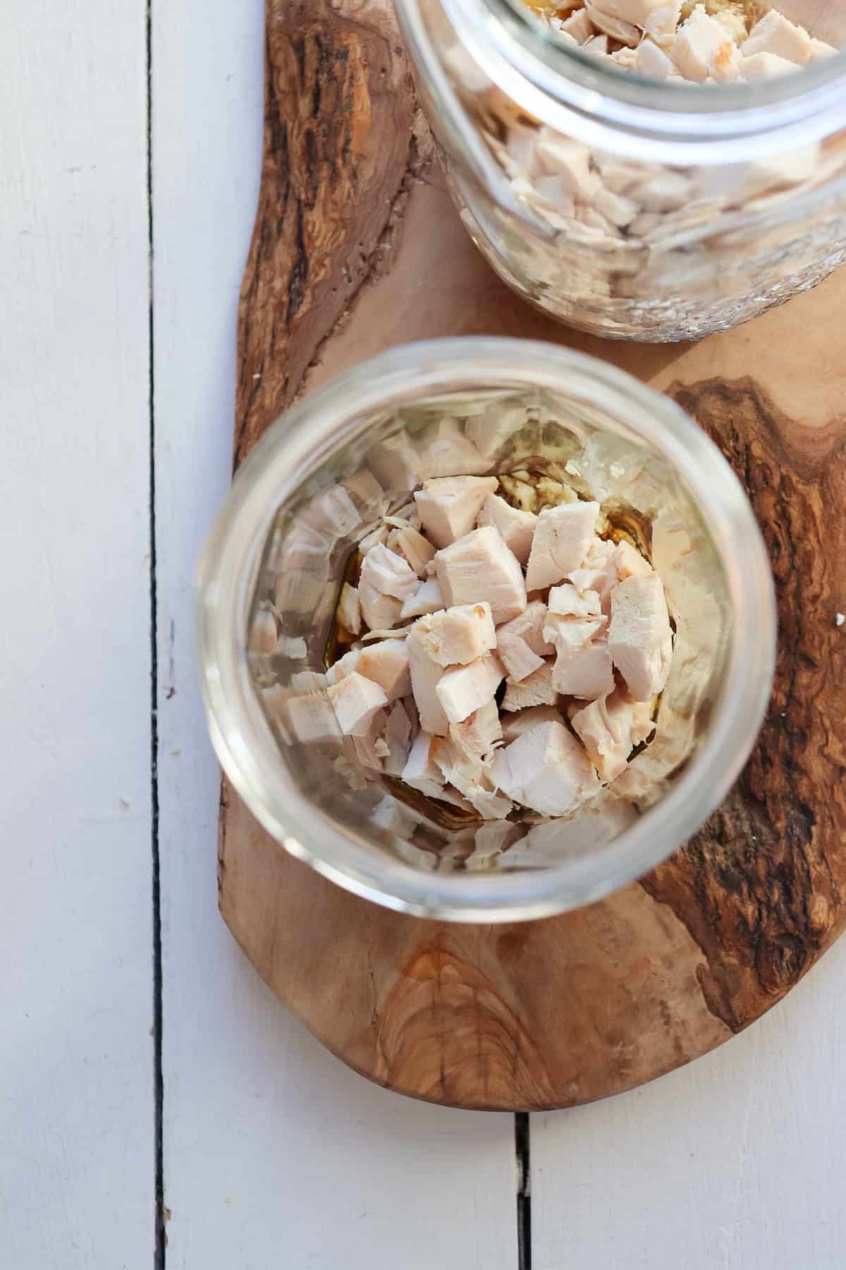 shredded chicken in mason jar for noodle cup.