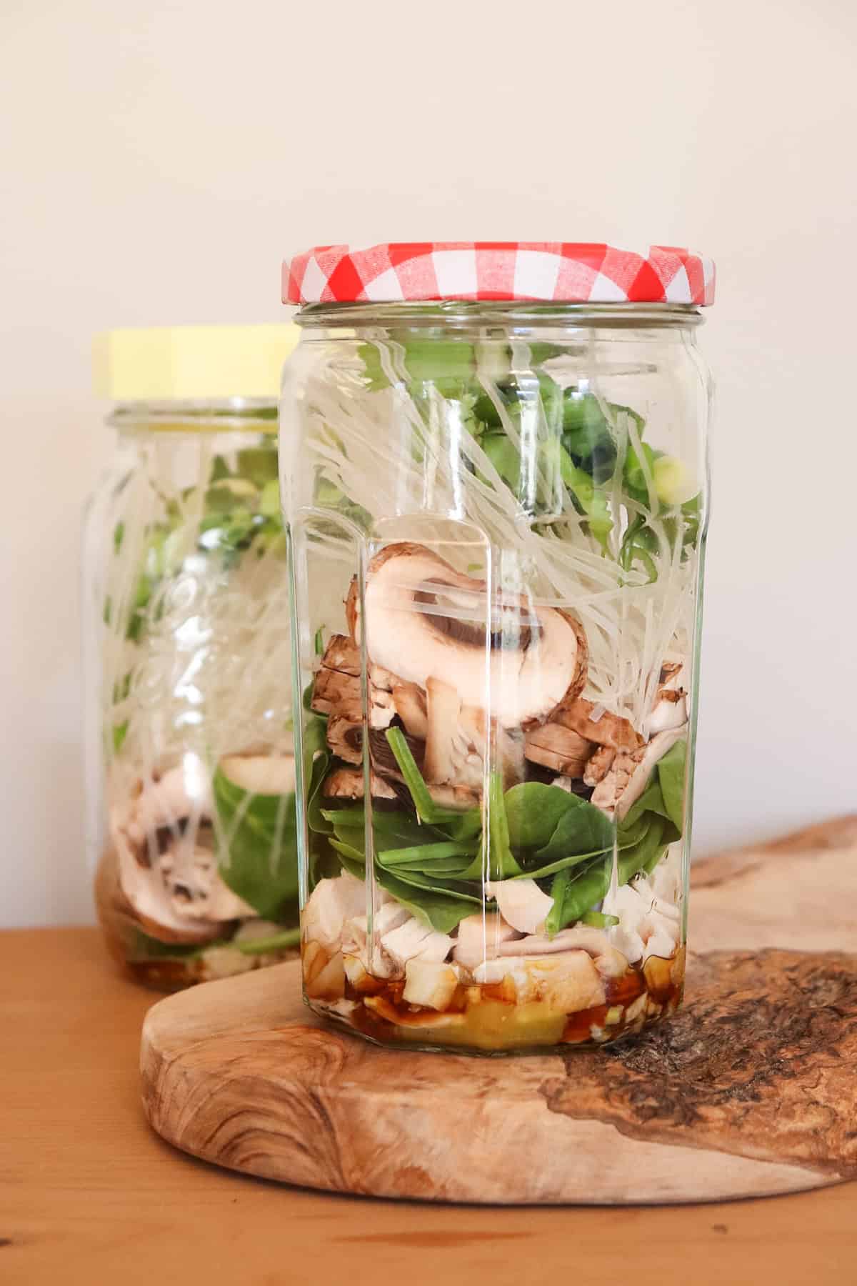 ingredients layered in mason jar for noodle cup.