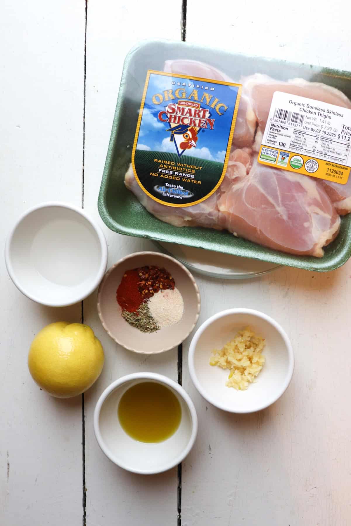 ingredients for nandos chicken thighs on a white table.