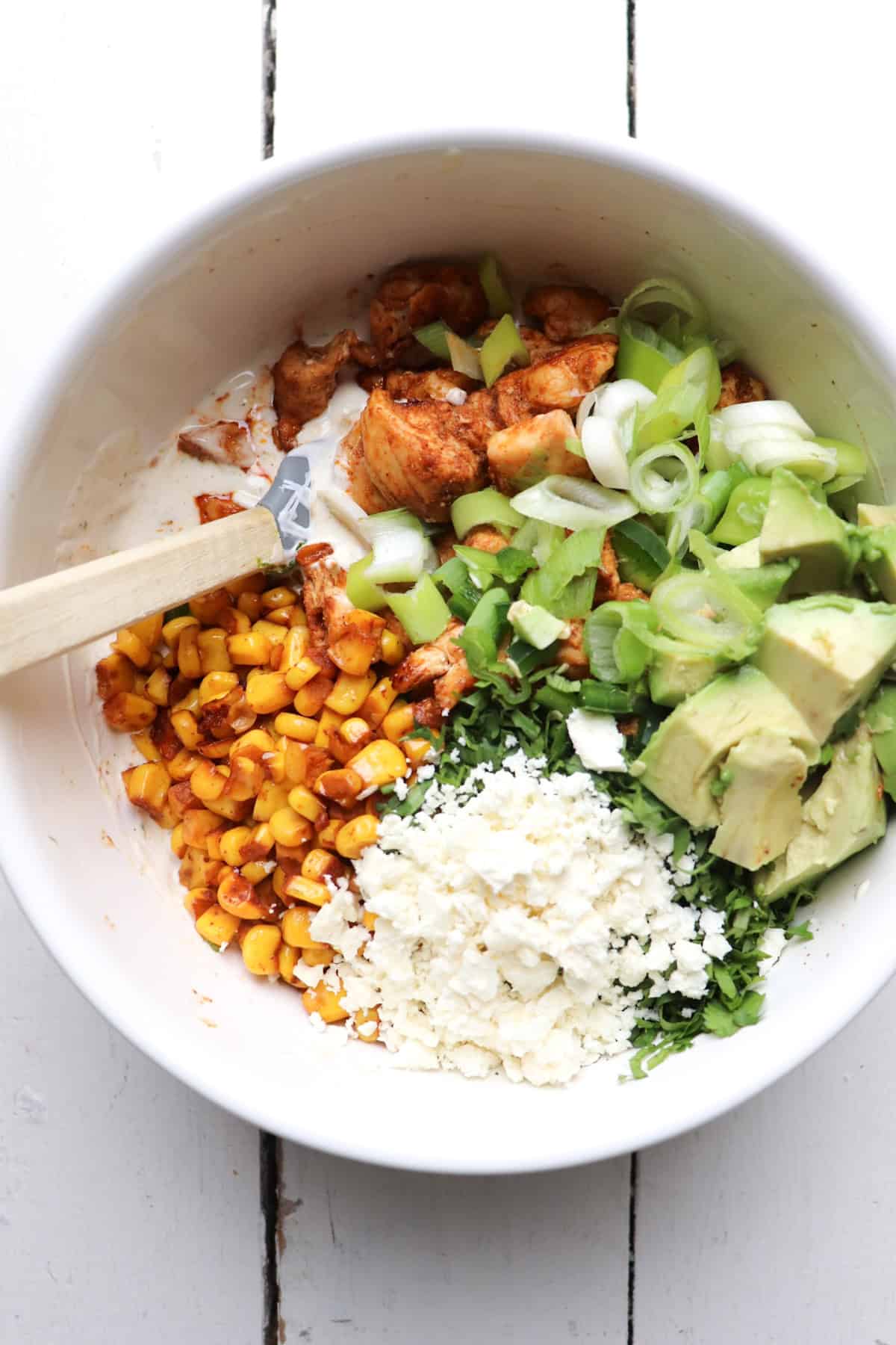 Bowl of ingredients for elotes chicken salad.