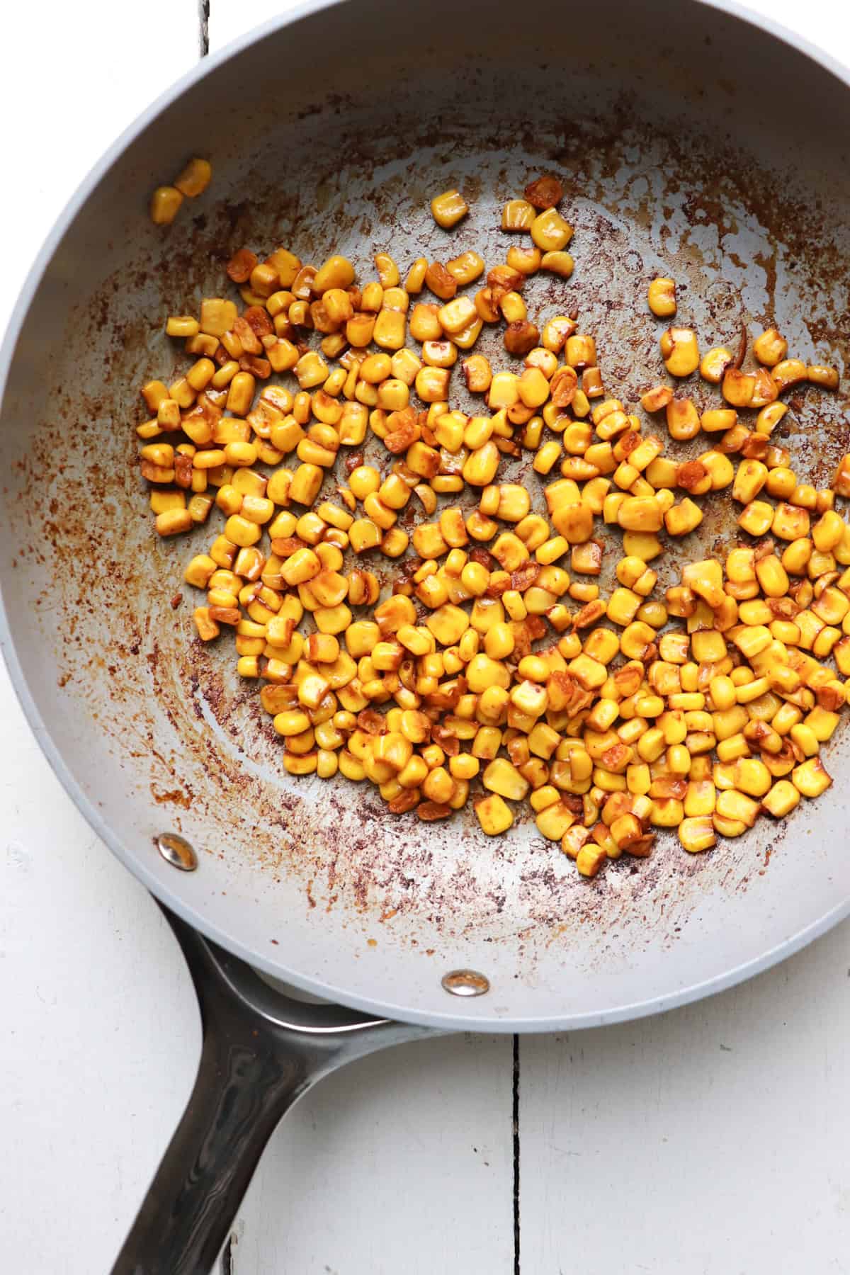 Sauteed corn in pan.
