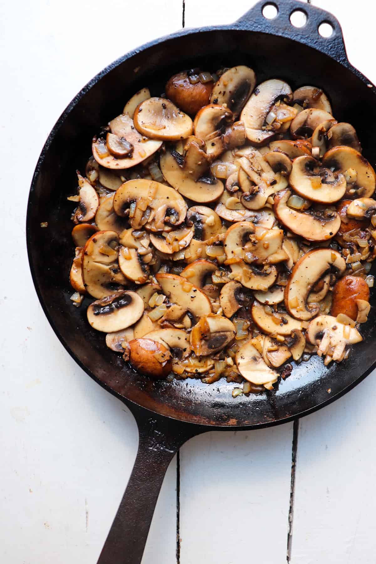 sauteed mushrooms in a cast iron skillet.
