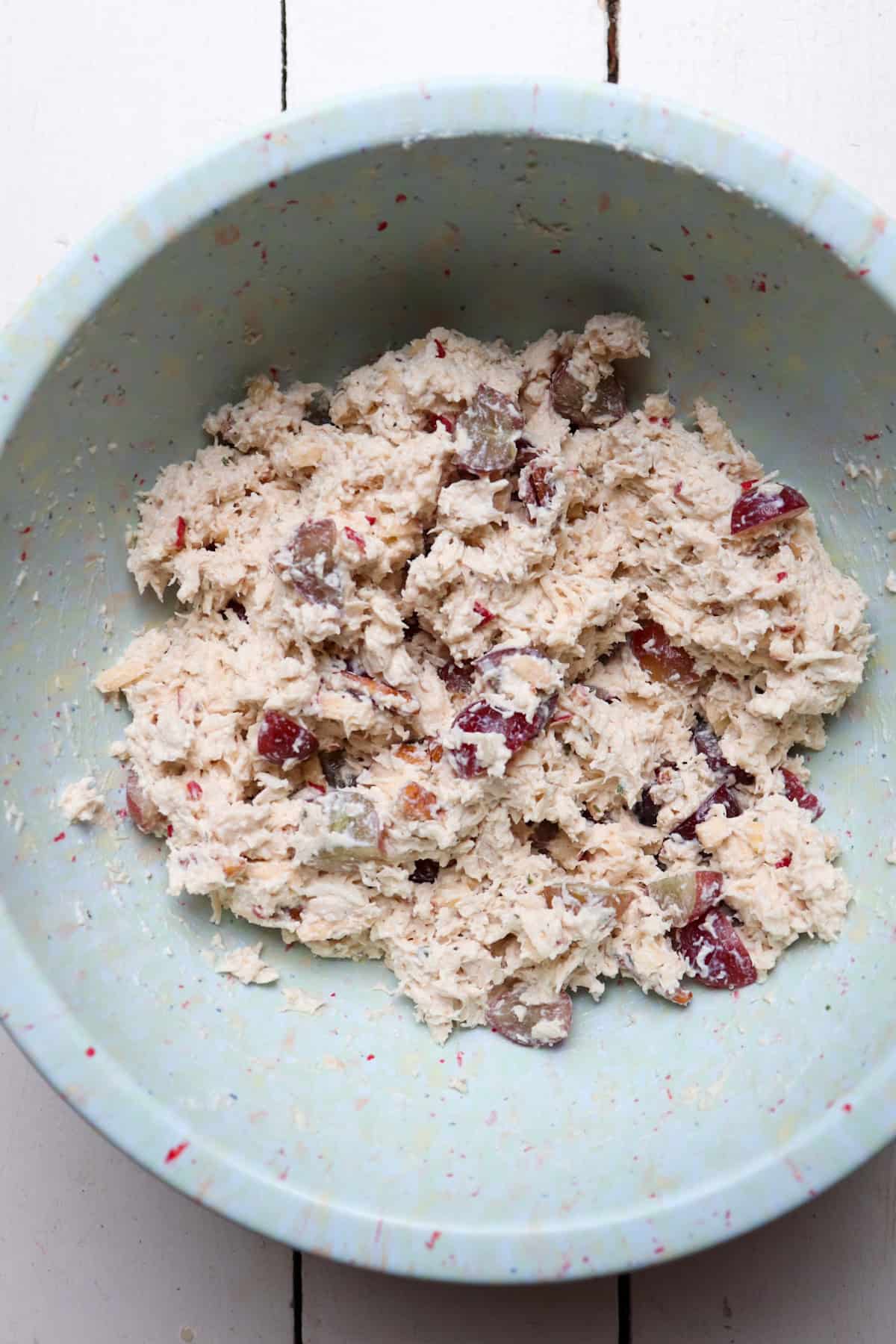 finished chicken salad in a large mixing bowl.