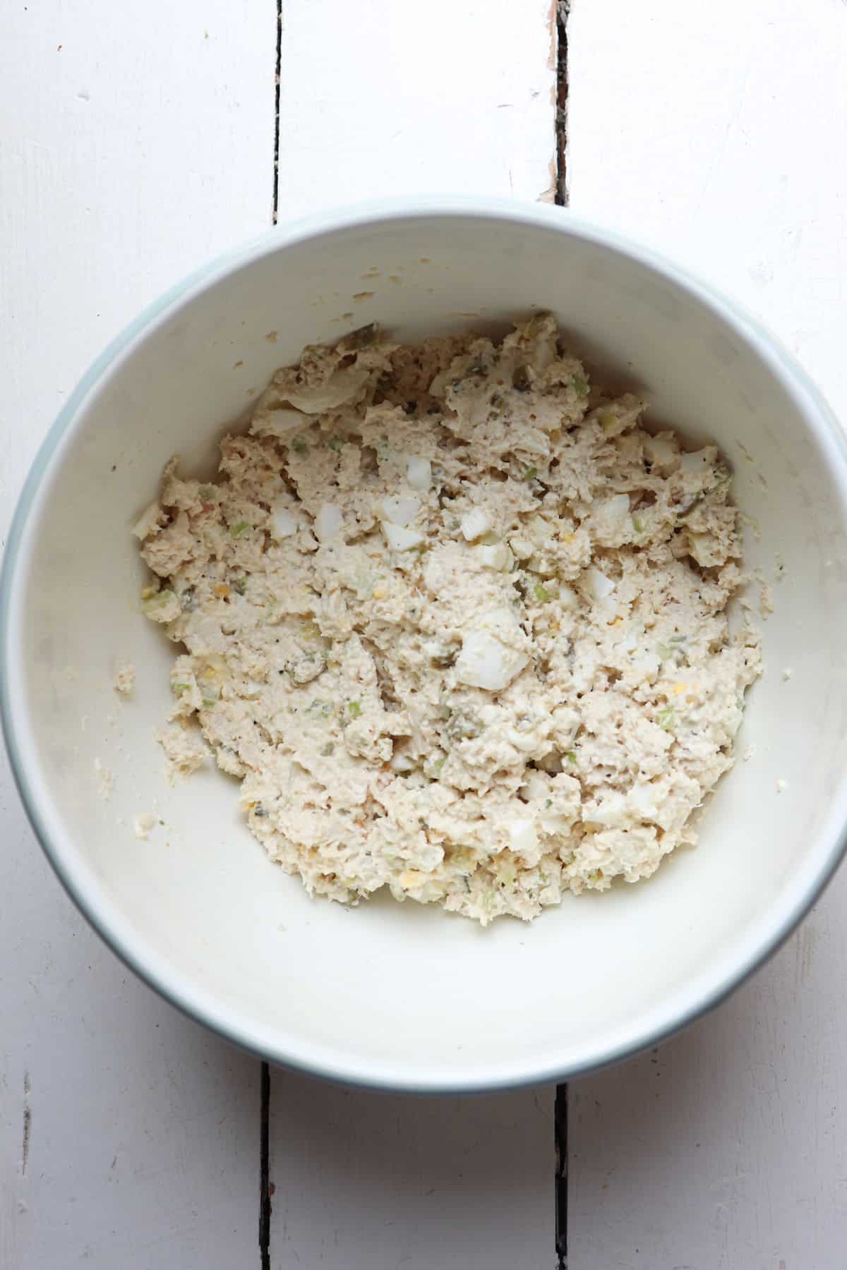 mixed ingredients for chicken salad in bowl.