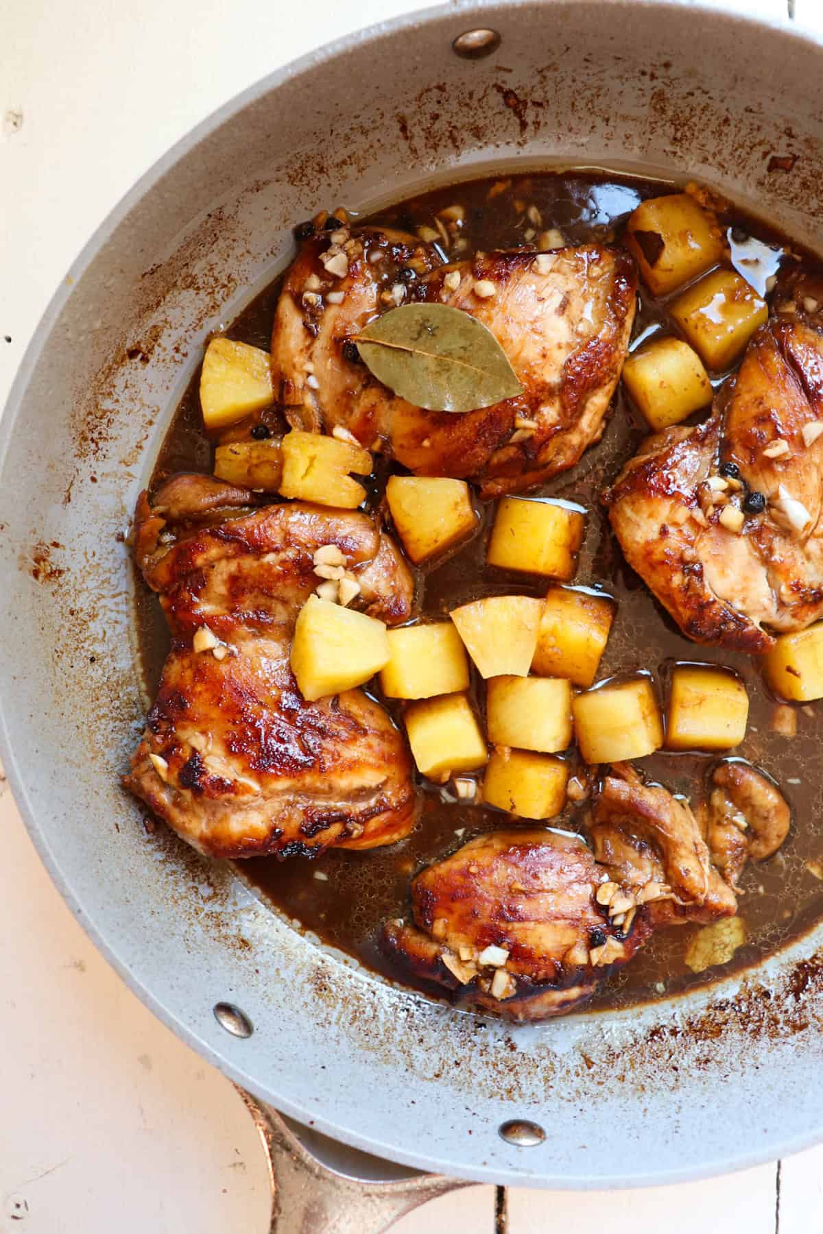 finished chicken adobo in a skillet.