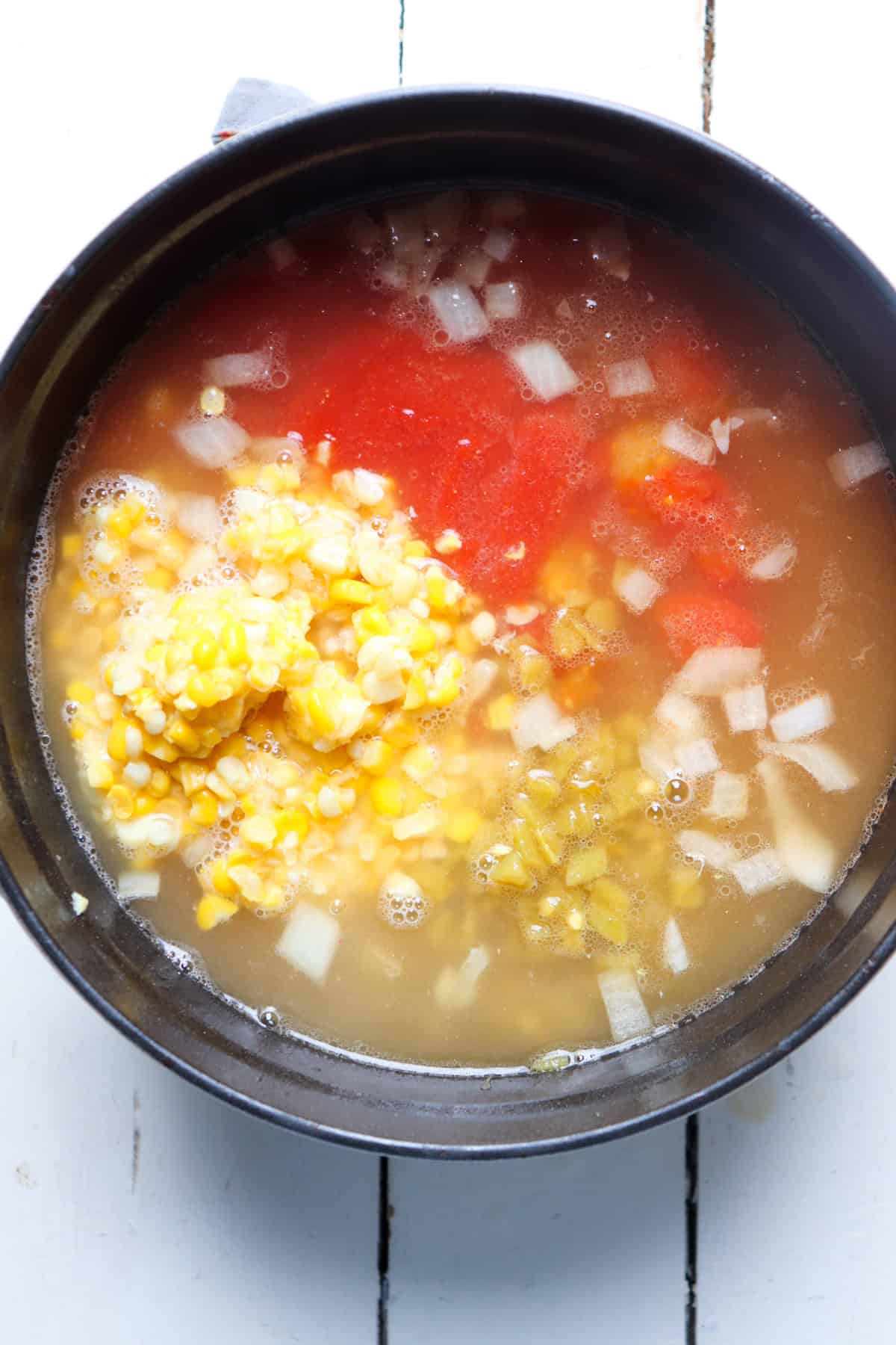 ingredients added to pot before they simmer.