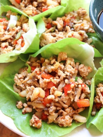 featured image of asian chicken lettuce wraps on a plate.