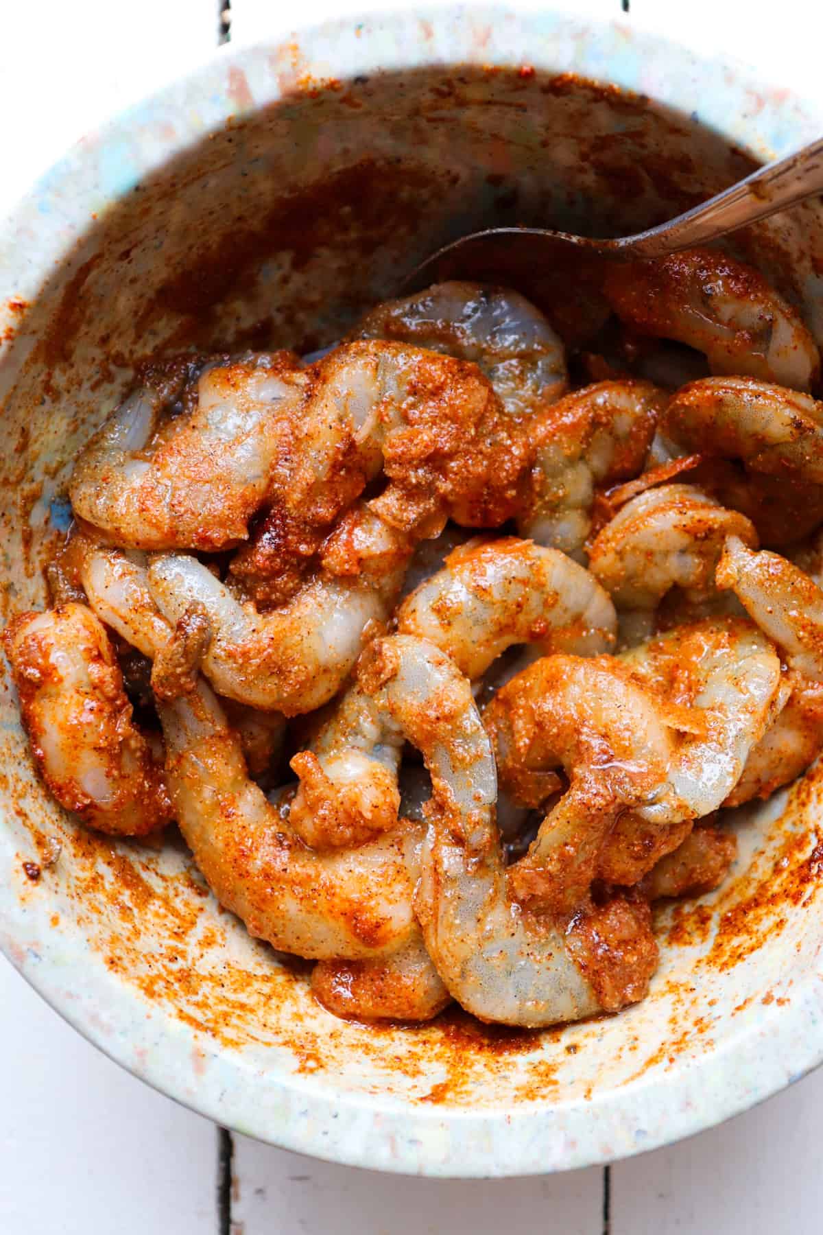 shrimp covered in spices and oil.