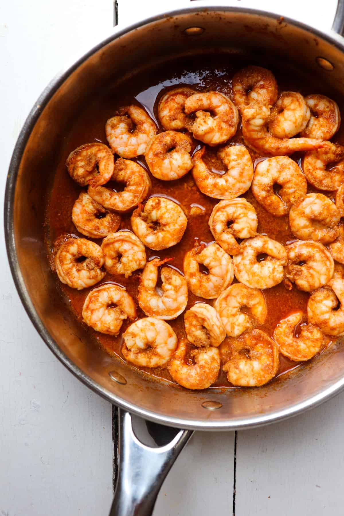 shrimp cooking in a skillet.