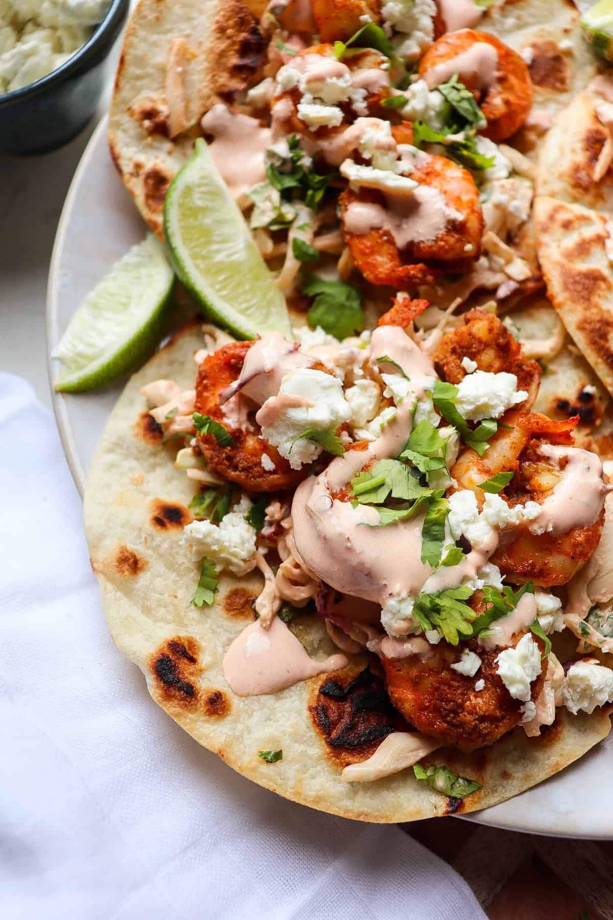 finished baja tacos with toppings.