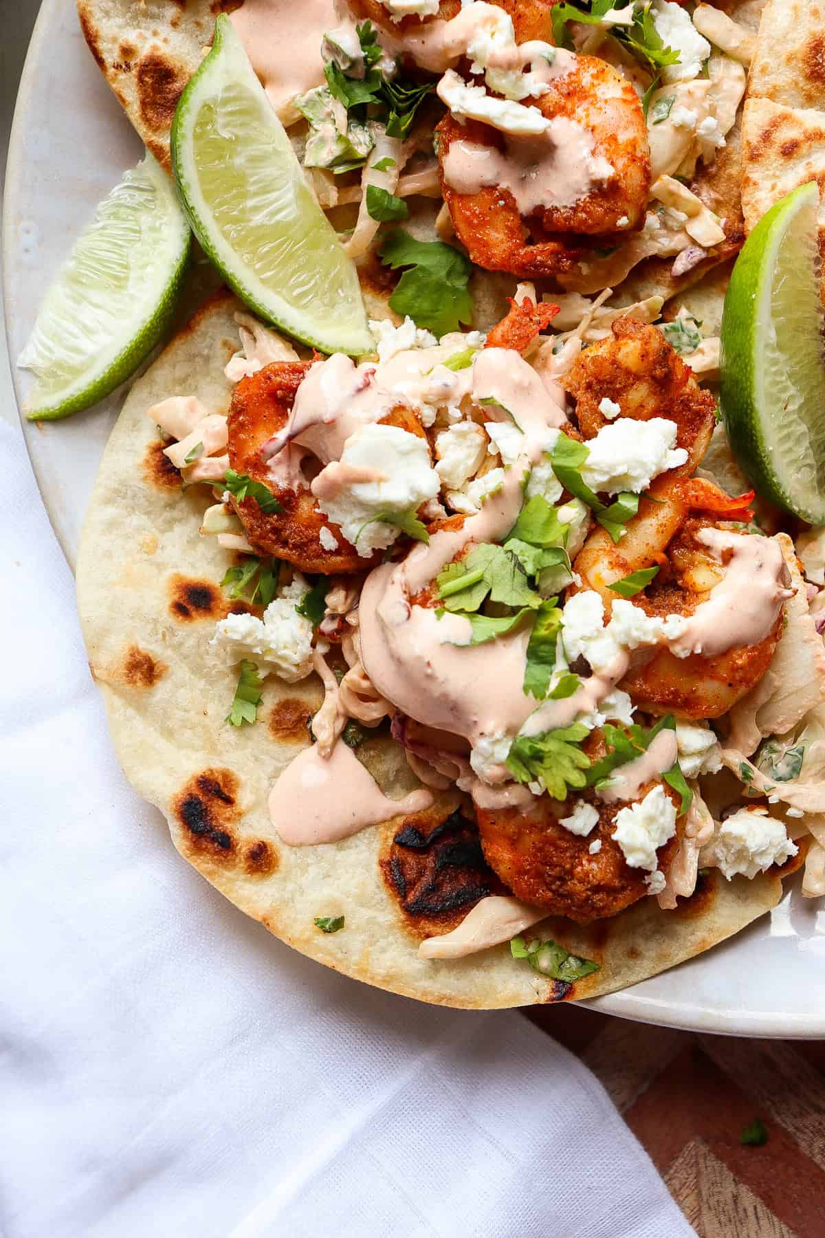 finished baja shrimp tacos with all of the toppings.
