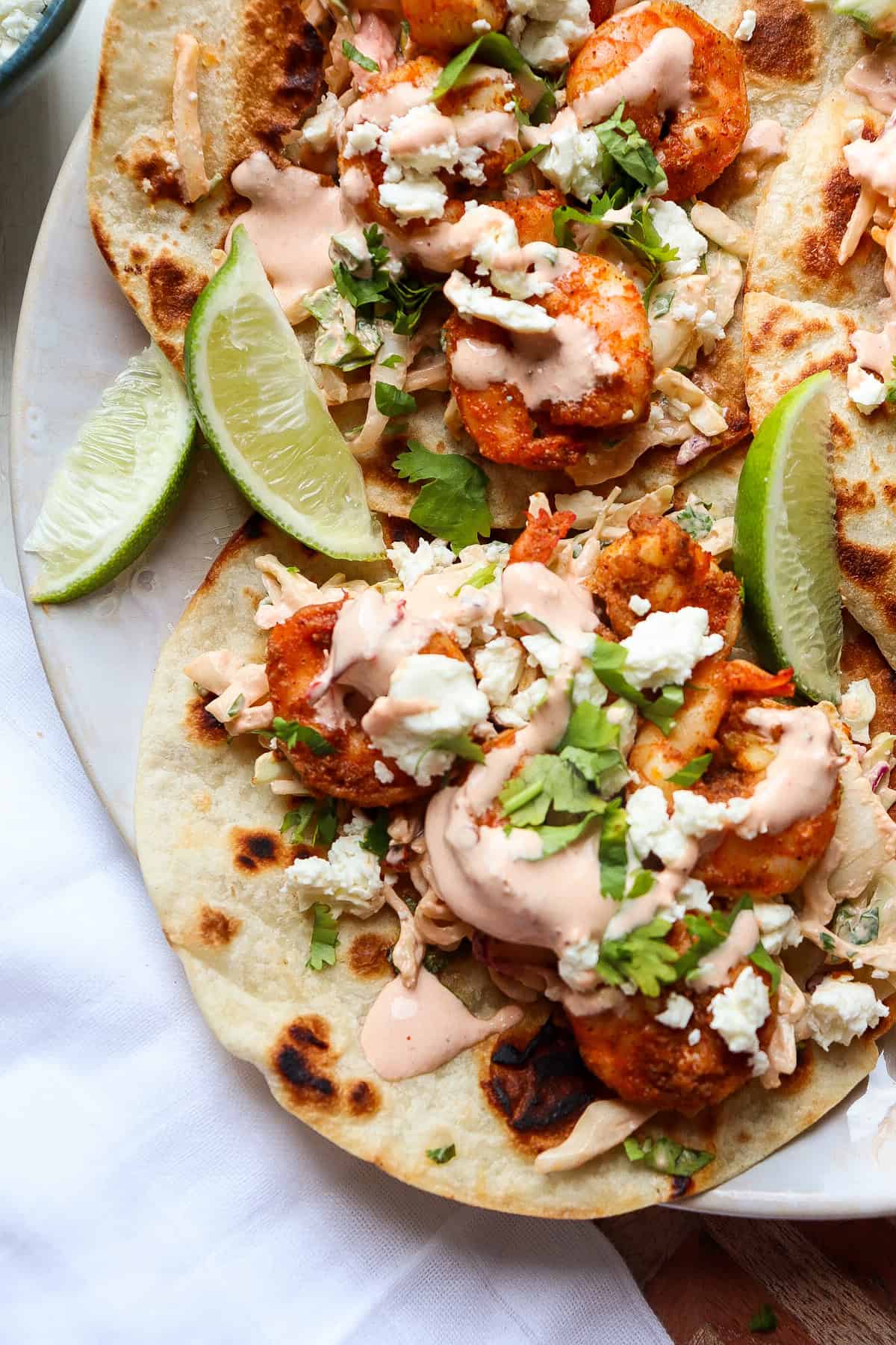 finished baja shrimp tacos with all of the toppings.