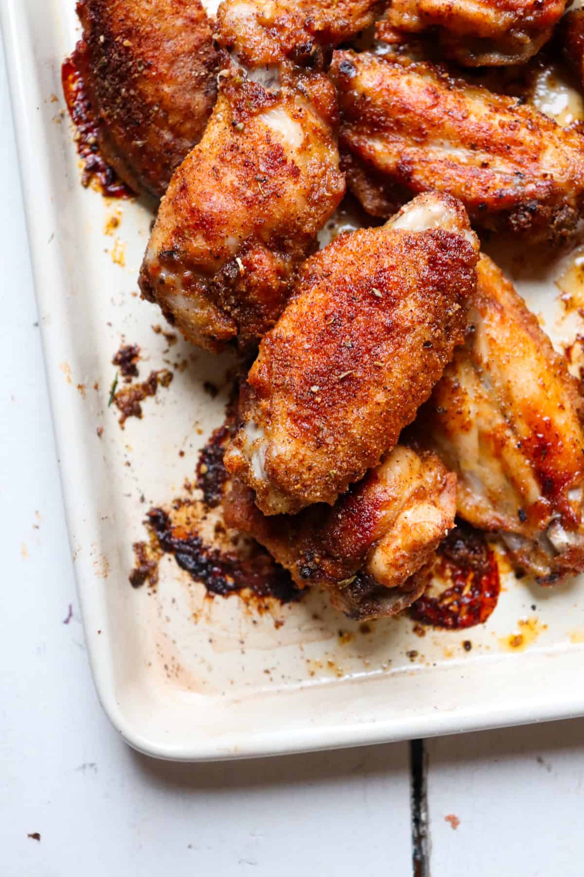 up close of cooked wing coated in dry rub.
