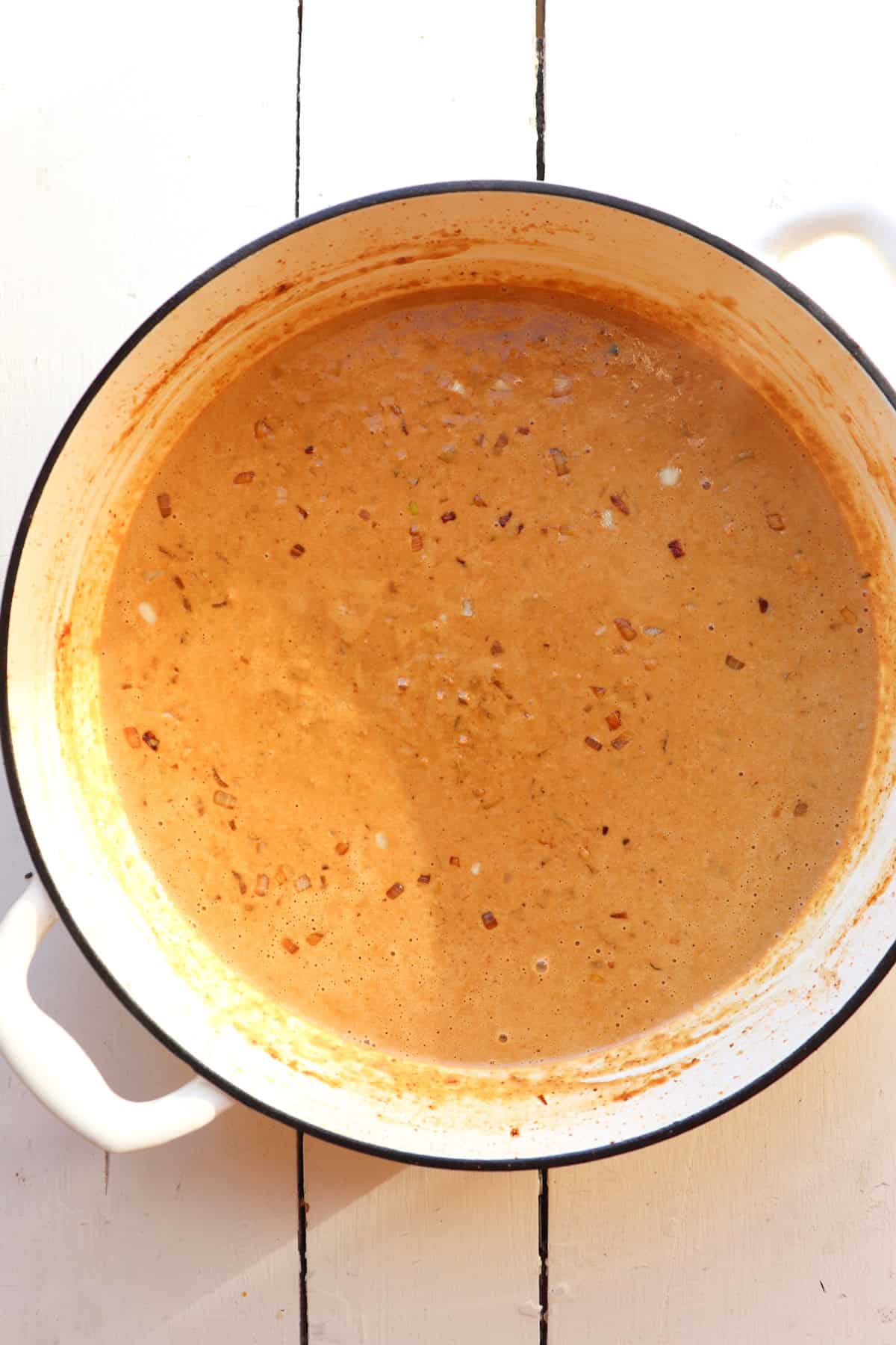 cheesy cream sauce in pot.