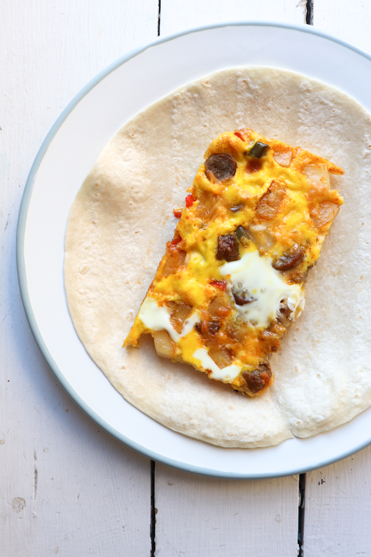 sheetpan eggs on plated tortilla.