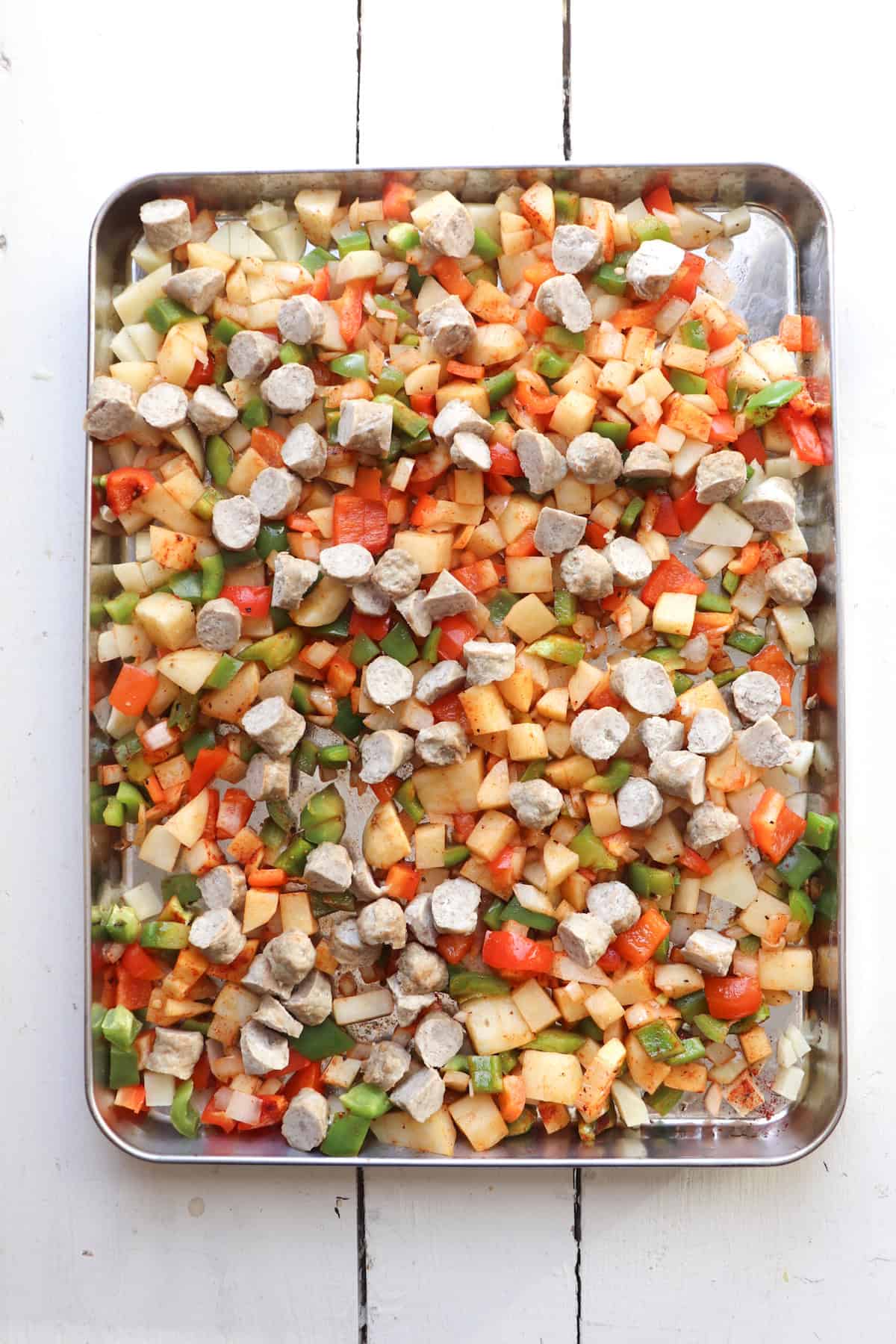 baking sheet with ingredients for breakfast burritos.