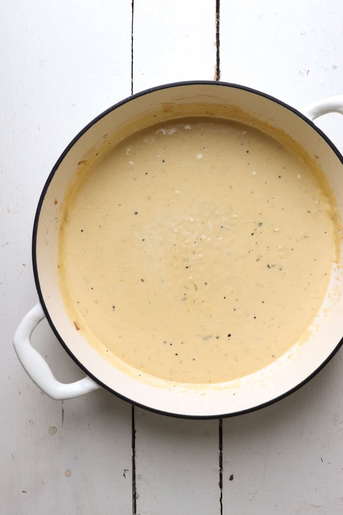 alfredo sauce in pan.