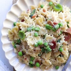 Bacon pea pasta on plate.
