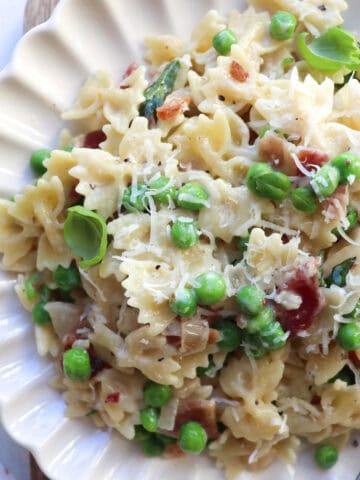 Bacon pea pasta on plate.