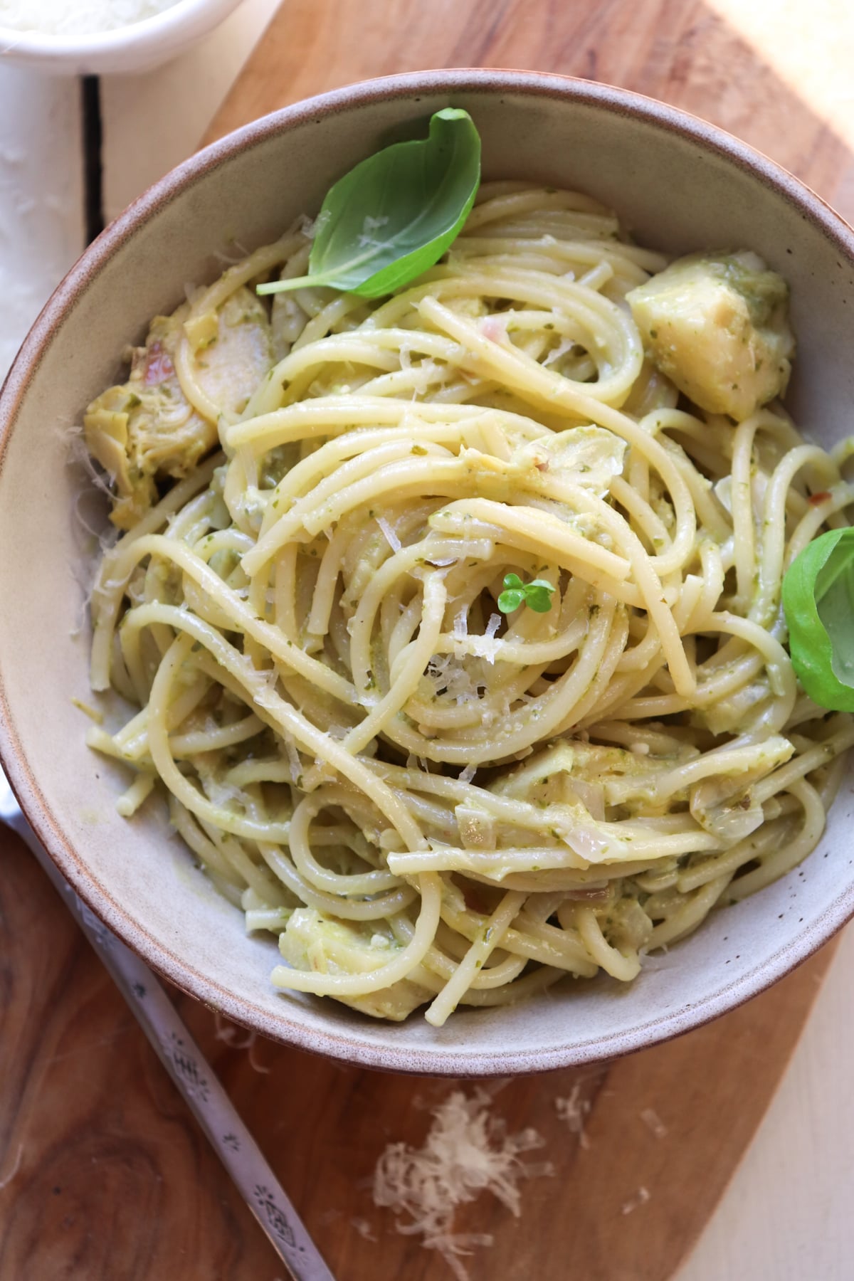 bowl of finished dish on a wooden board.