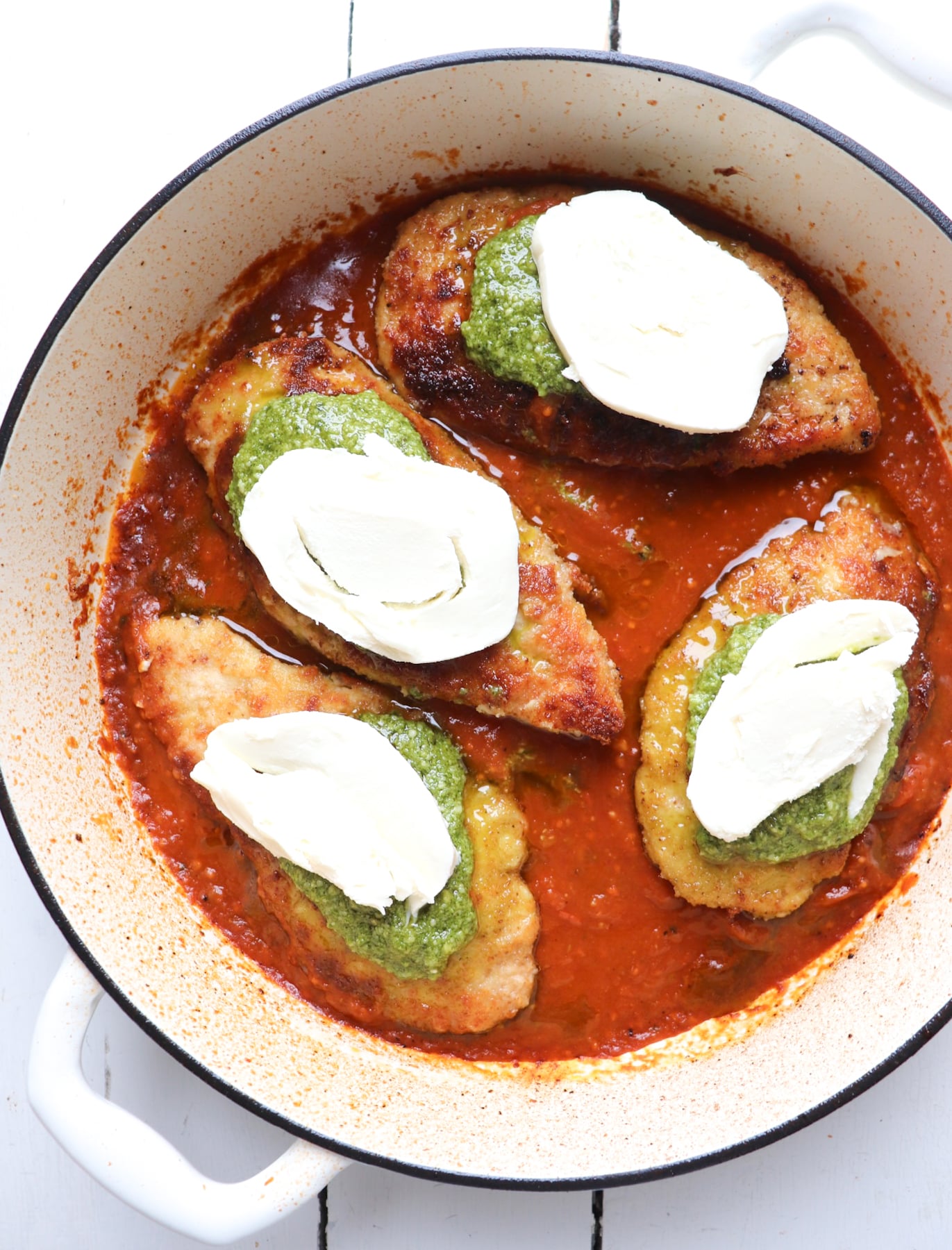 mozzarella cheese pieces place on chicken cutlets.