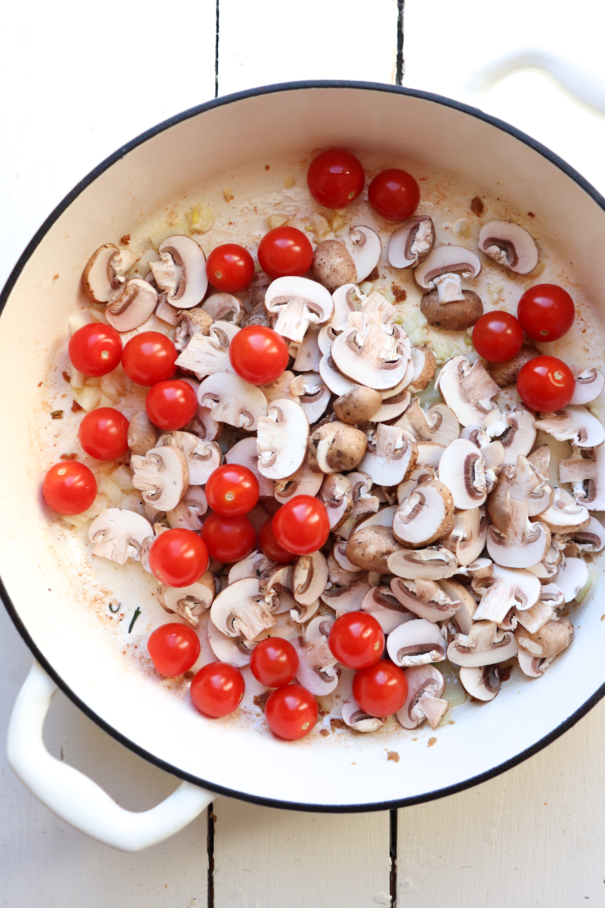 tomatoes and mushrooms added to pot.
