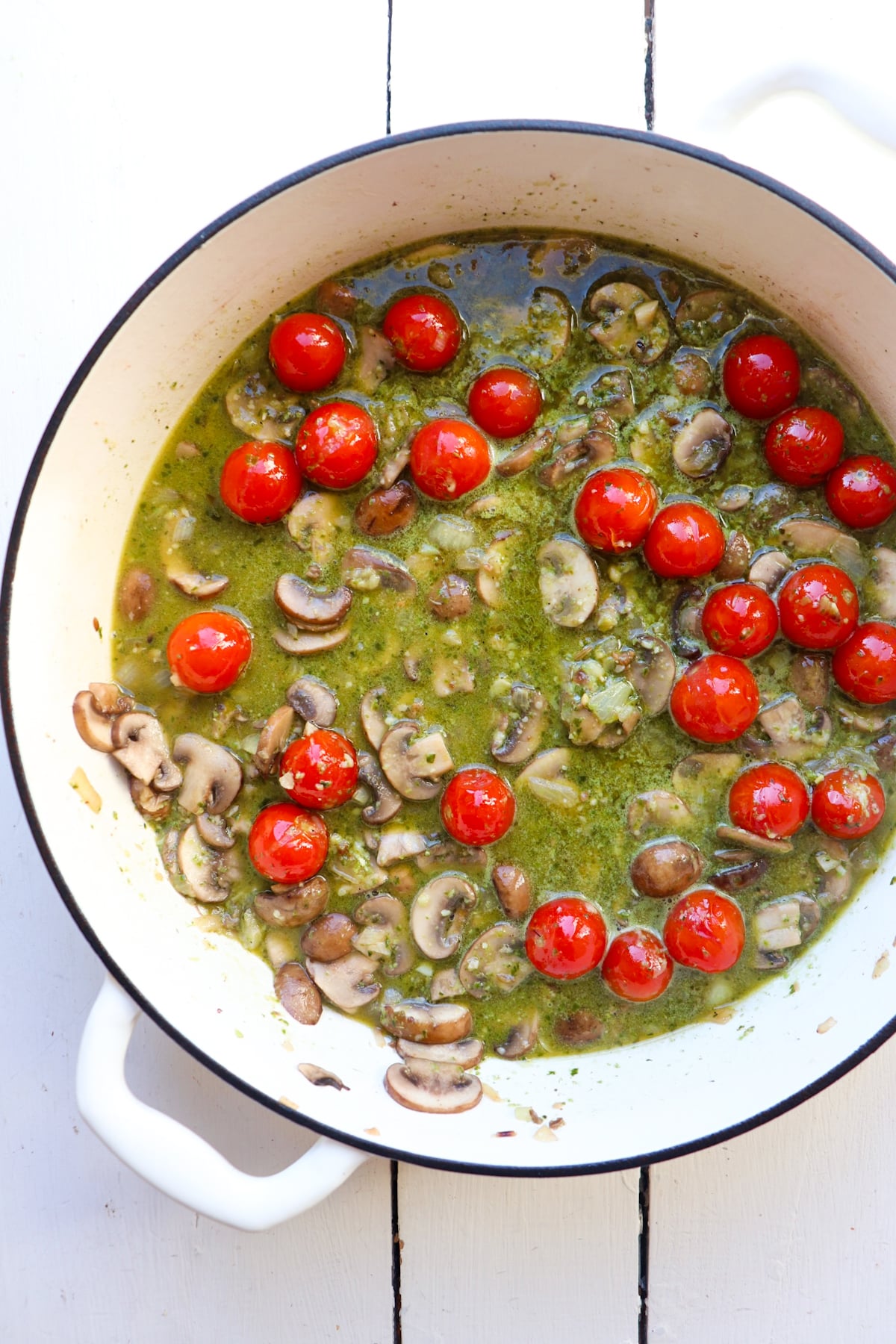 pesto sauce added to sauteed ingredients.