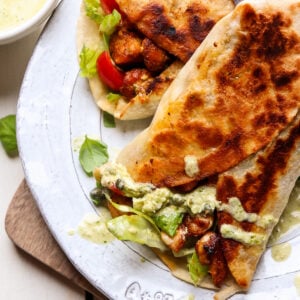 pesto chicken wraps on a plate.