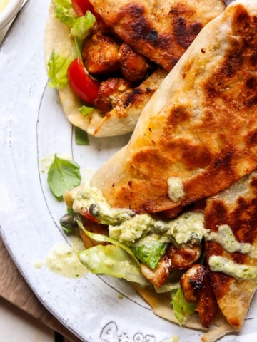 pesto chicken wraps on a plate.