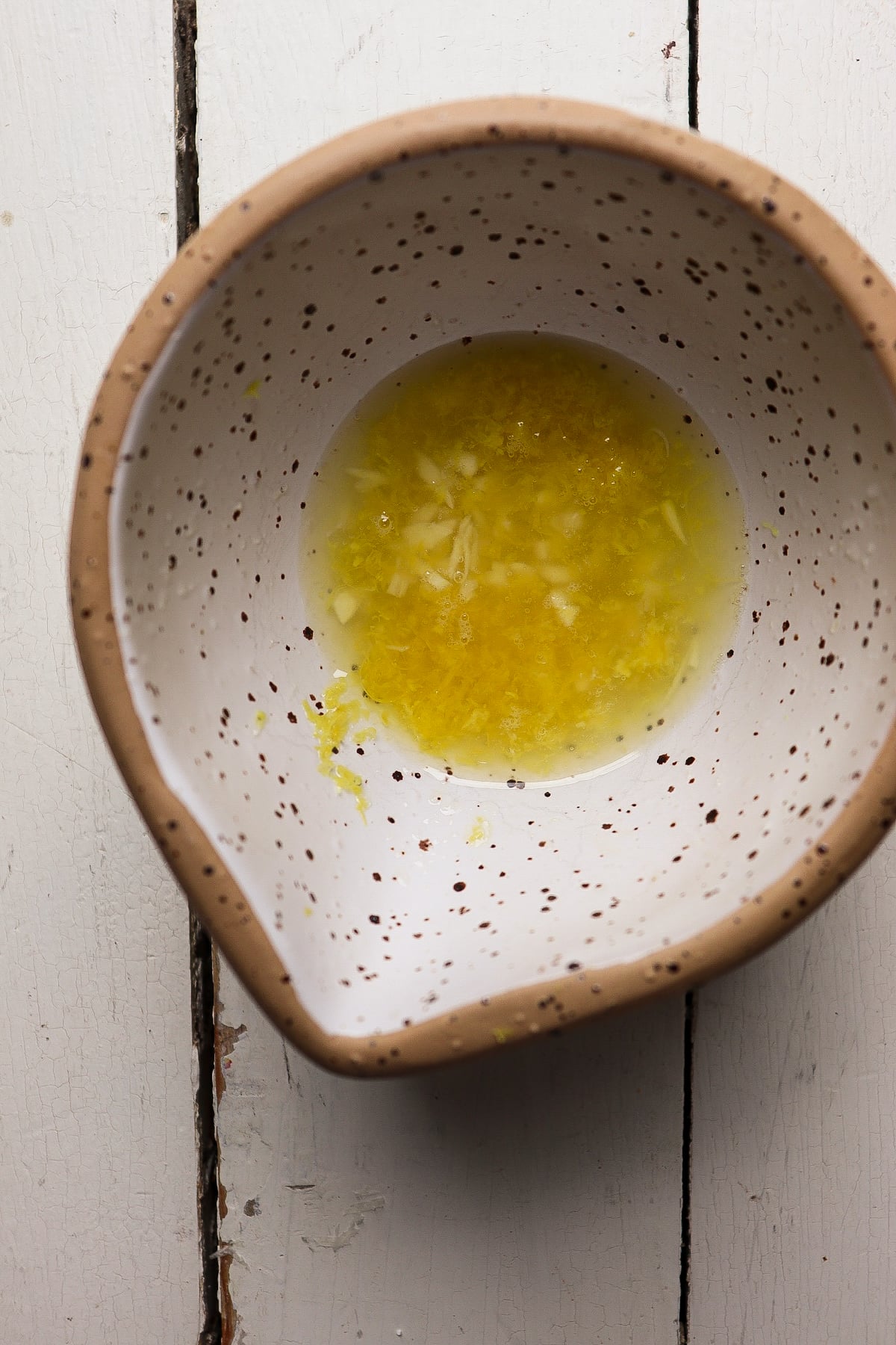 minced garlic in lemon juice in a small bowl.