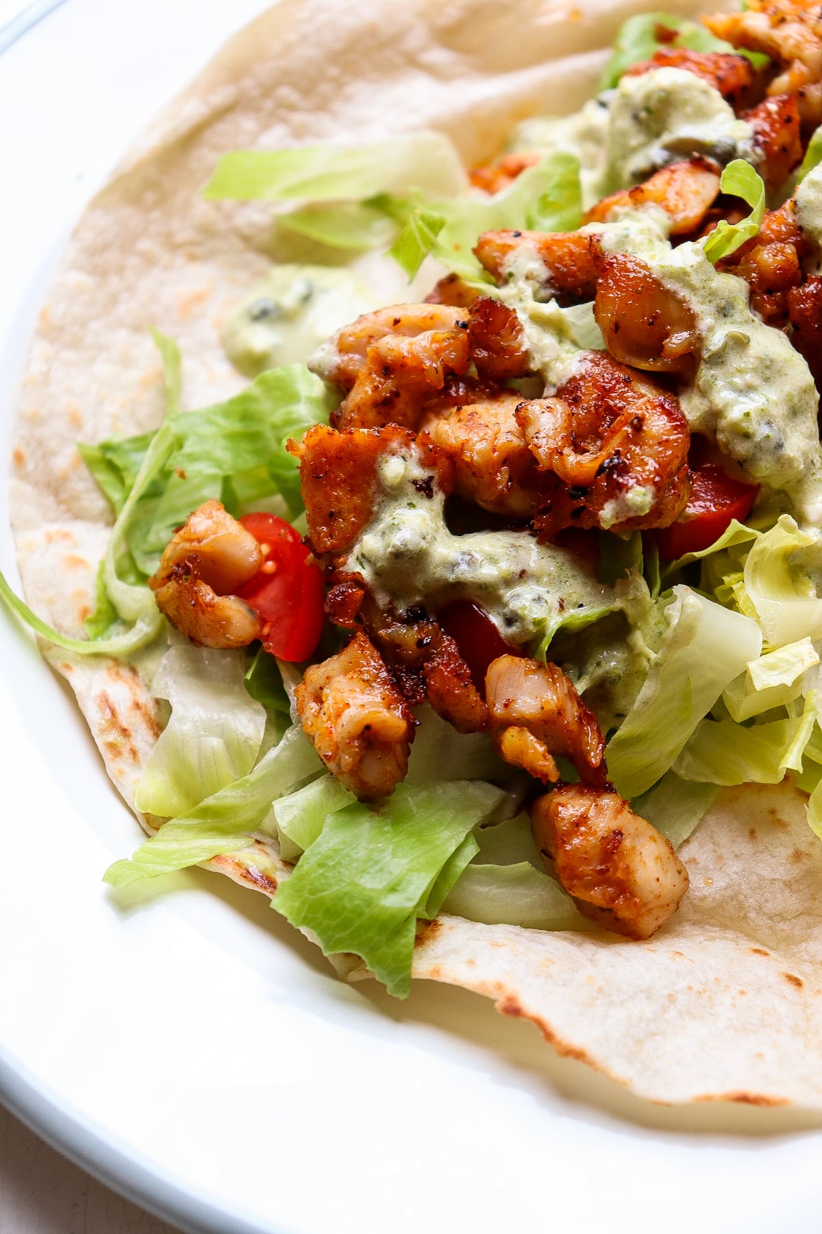 pesto wrap on a plate before it has been wrapped up.
