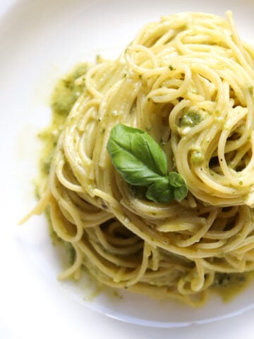 angel hair pasta swirled with pesto ricotta sauce featured image.