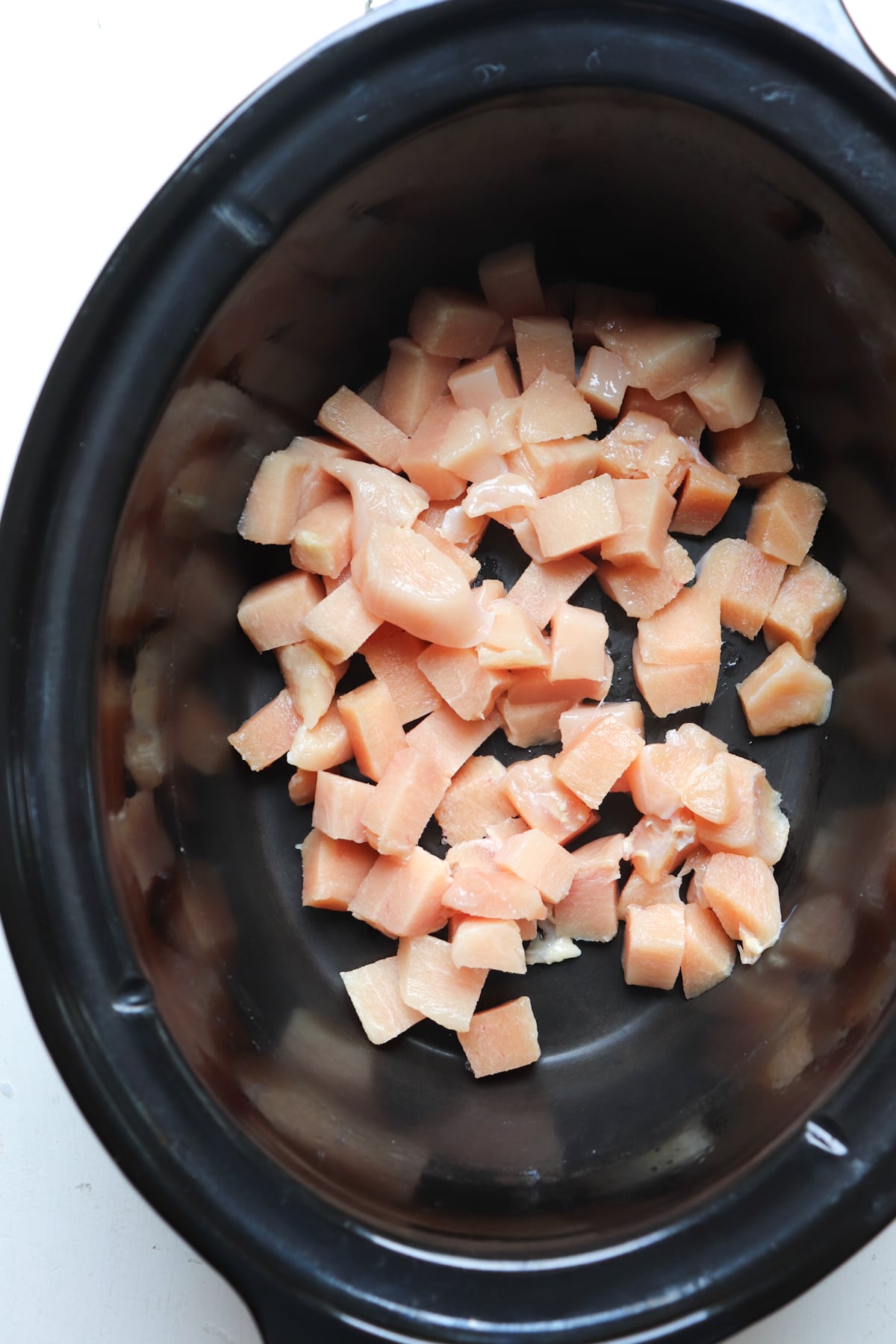 raw chicken in crockpot.