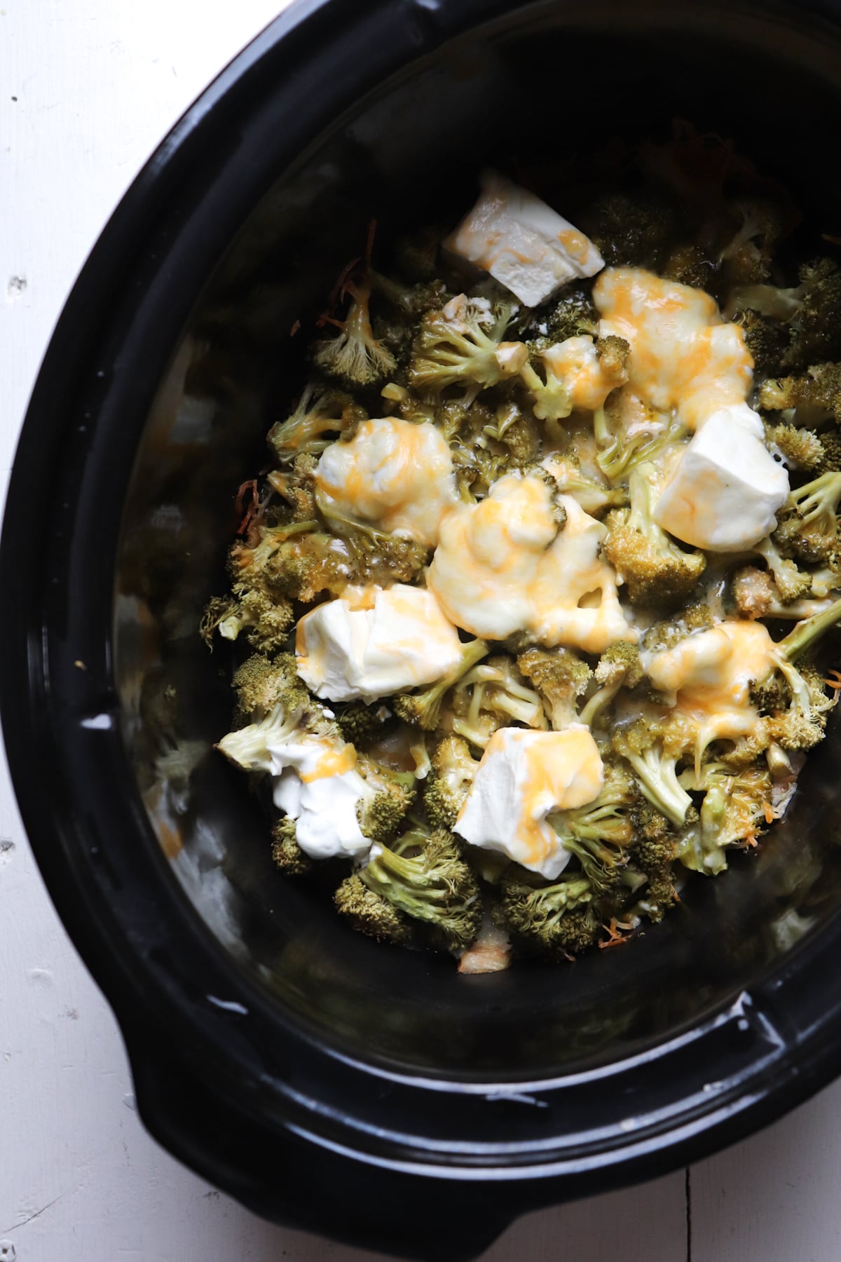 cooked cheese broccoli and yogurt in crockpot.