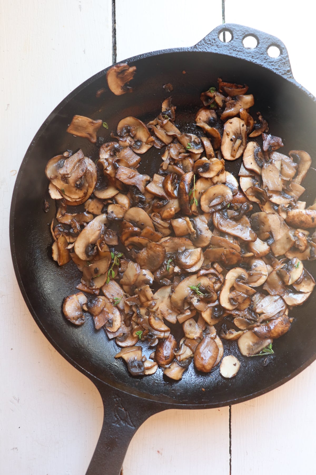 sauteed mushrooms in a cast iron skillet.