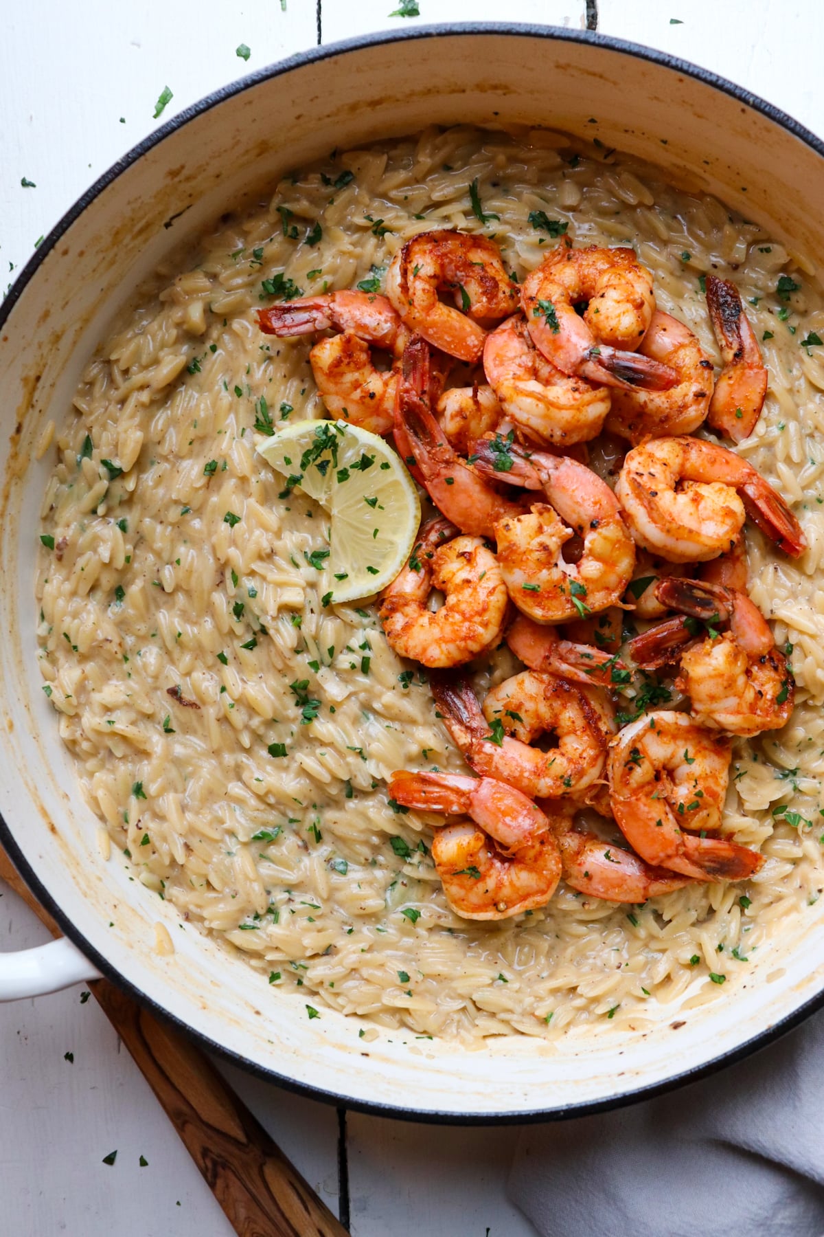 shrimp and orzo in cooking pan.