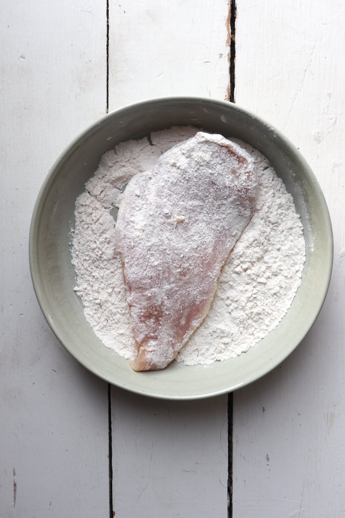 chicken breast coated in flour.