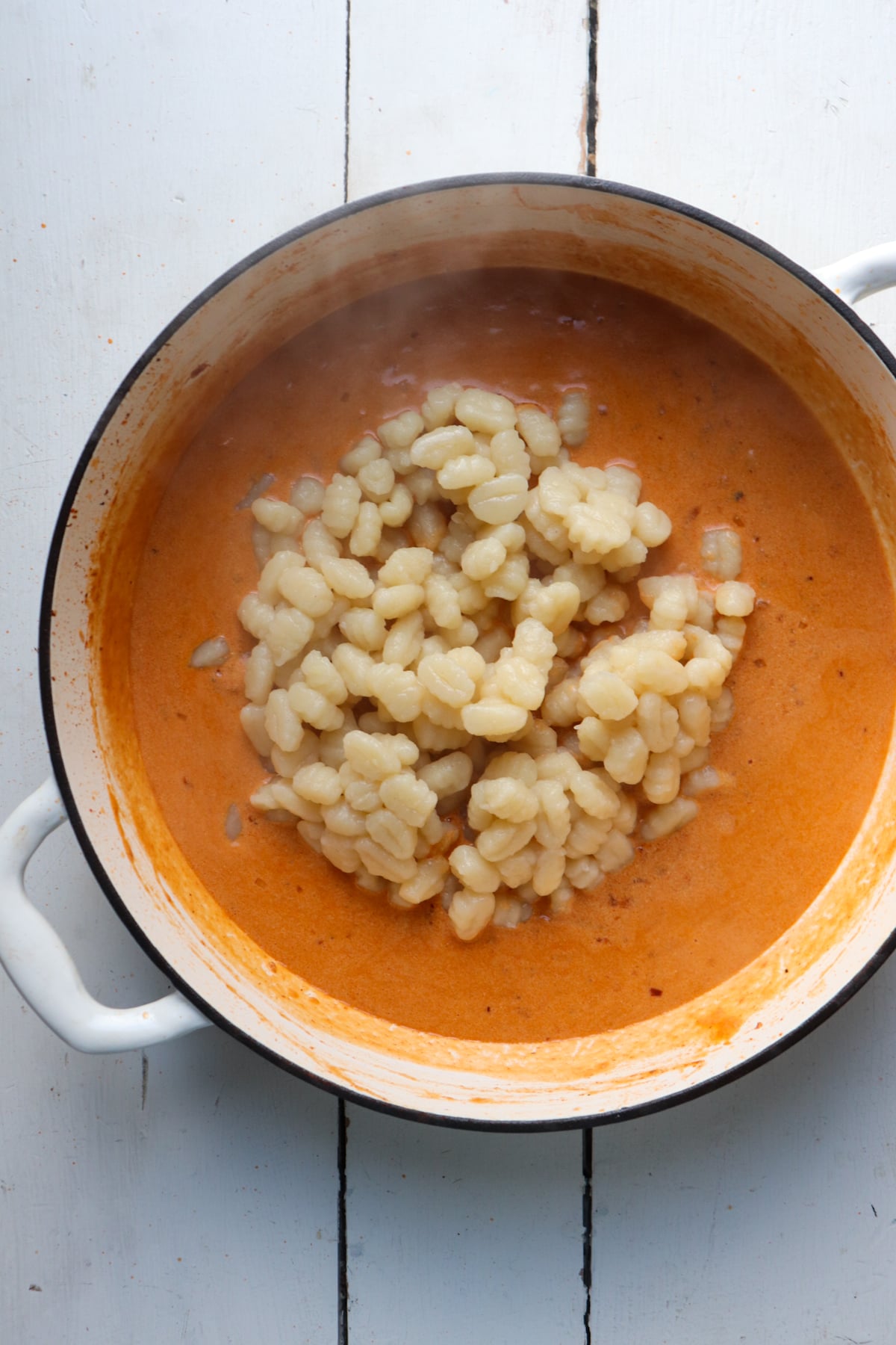cooked potato gnocchi added to light orange vodka sauce.