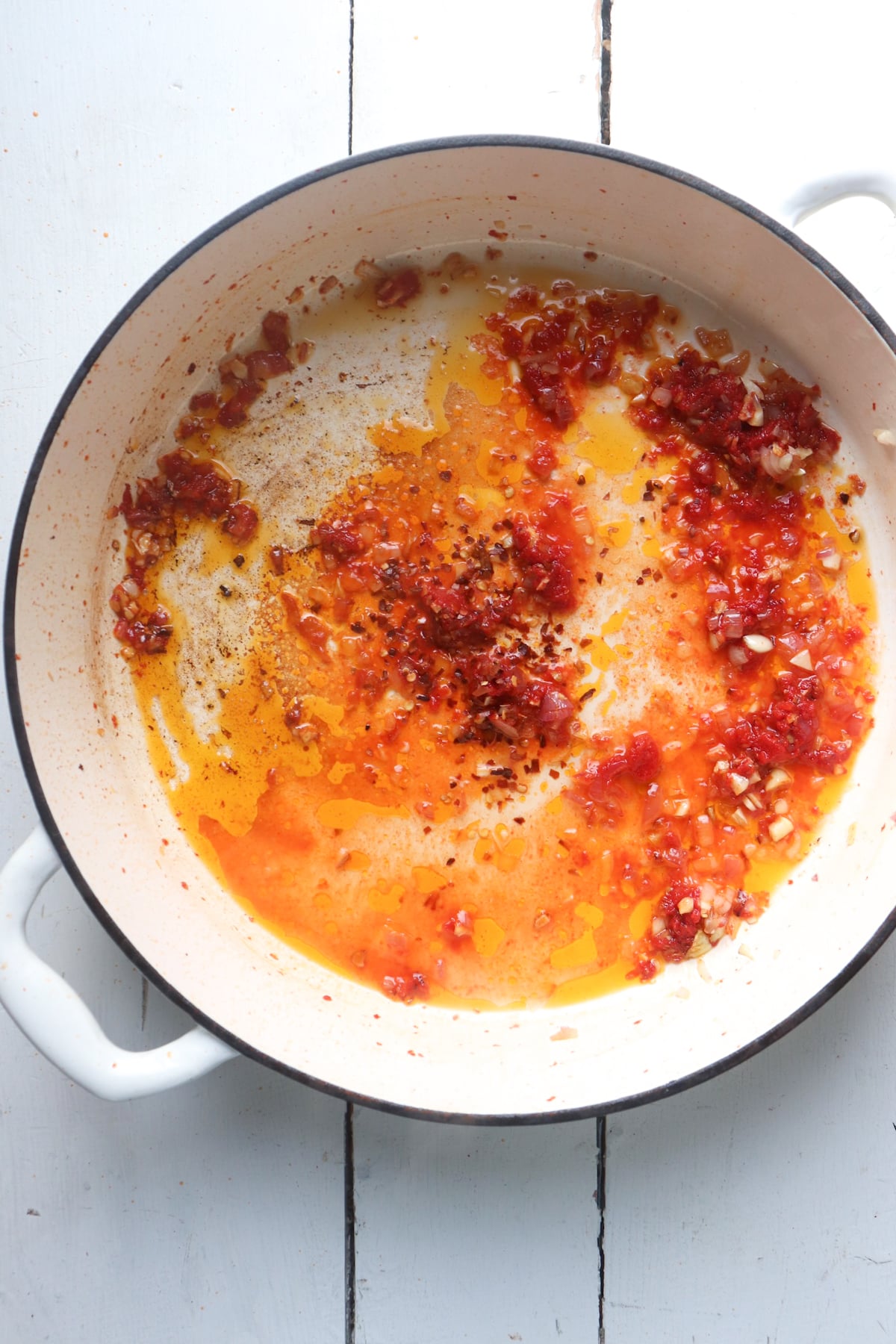 sauce ingredients being deglazed with vodka.