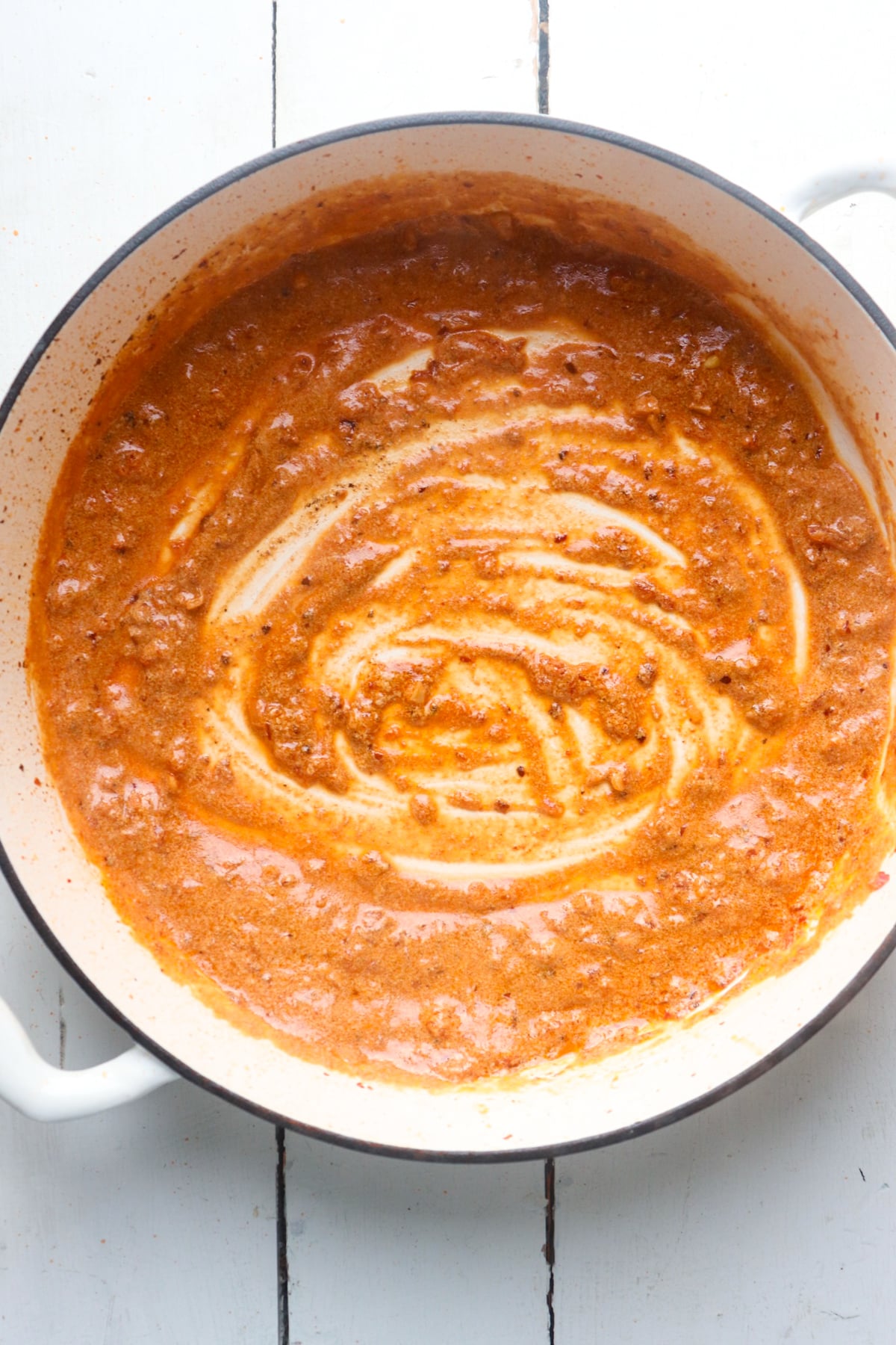 heavy cream added to begin creating the sauce.